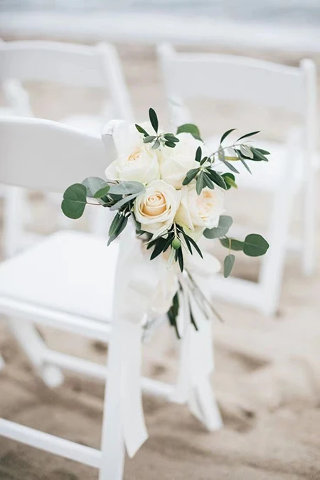 Flower decoration for guests' chairs Flower decoration for guests' chairs